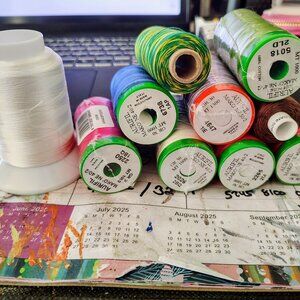 Assorted colored Aurifil spools made of cotton 9 piece set